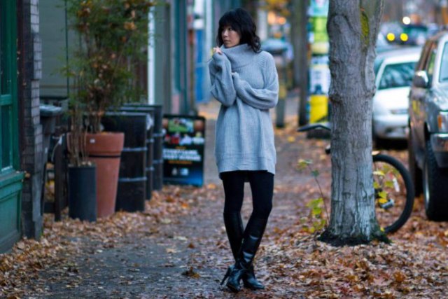 gray, chunky tunic sweater with mock neck, black leggings and knee-high leather boots
