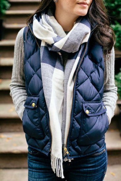 Dark blue quilted vest with gray rib sweater