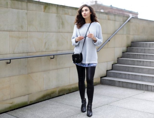 Light gray sweater over batik tunic top and leather leggings