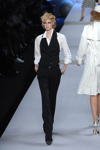 black suit vest with white shirt and suit pants