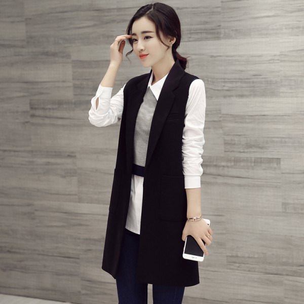 black longline vest with white tunic shirt and gray mini vest