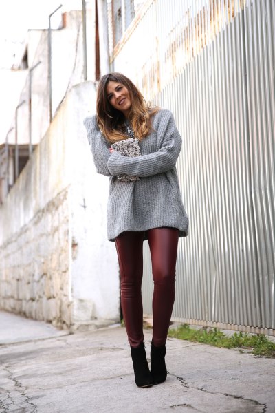 gray, ribbed, thick sweater with burgundy leather leggings