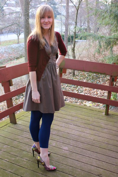 gray, flared, knee-length dress with dark blue, footless tights