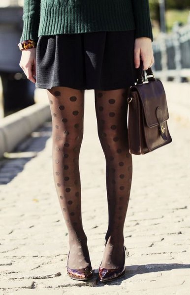 gray cable knit sweater with black mini skirt and dotted tights