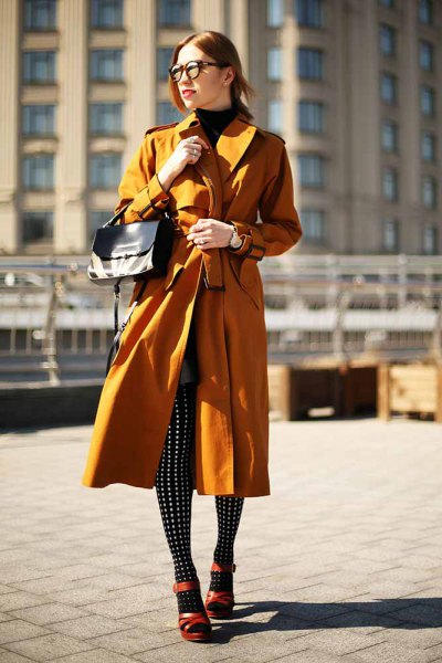 lime green longline trench coat with black and white polka dot leggings