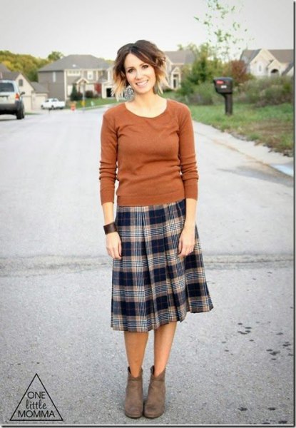 green sweater with scoop neck and midi plaid pleated skirt