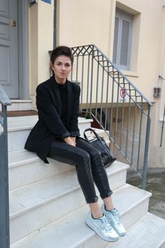 black wool blazer with leather pants and silver metallic sneakers