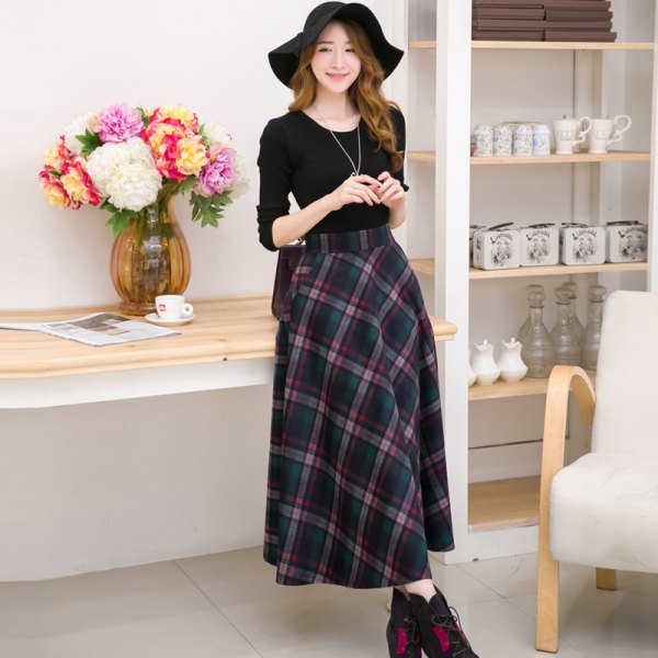 black long-sleeved t-shirt with a scoop neck and a maxi-gray checkered wool skirt