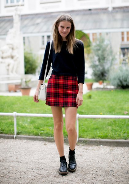 black sweater with red checkered high rise mini skirt