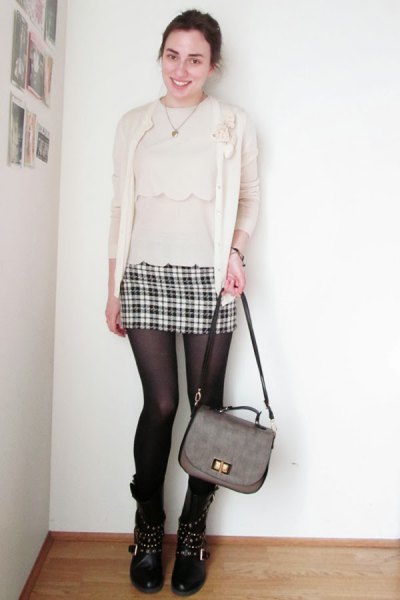 light pink blouse with matching cardigan and mini skirt