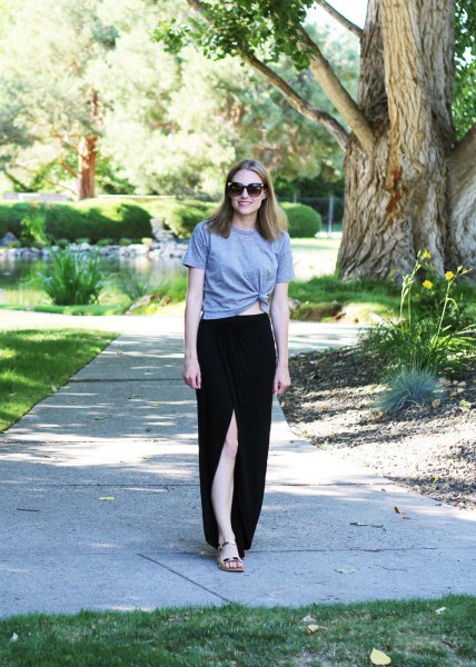gray knotted t-shirt with black maxi skirt made of cotton with high slit