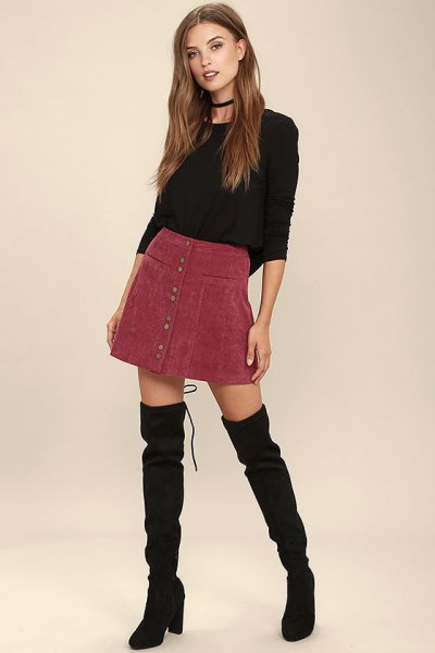 black, tailored sweater with round neck and burgundy cord mini skirt