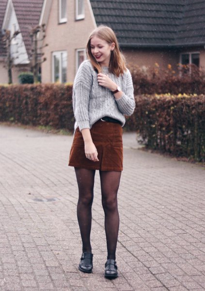 gray, ribbed, rough knitted sweater with brown cord mini skirt