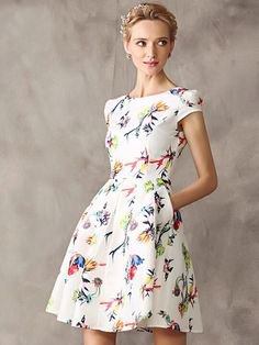 white dress with short sleeves and flared mini flower pattern