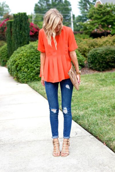 orange peplum blouse with torn skinny jeans