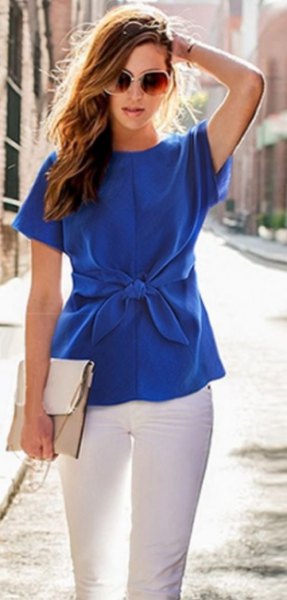 blue tie waist short sleeve silk blouse with white skinny jeans