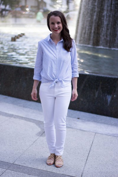 light blue and white vertical striped knotted shirt with slim jeans