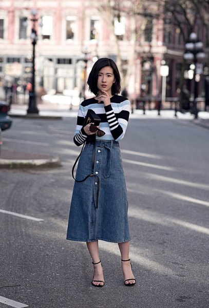 black gray and white striped sweater with blue midi button in front skirt