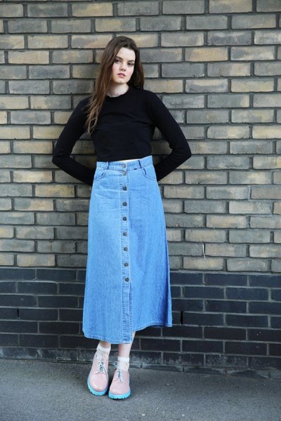 black, slightly shortened bell sleeve top with blue skirt with long denim button on the front