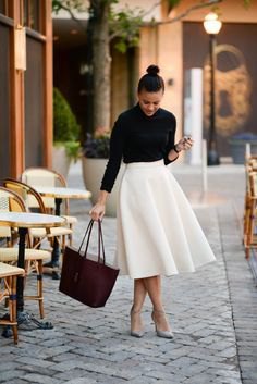 black shirt with buttons and white midi skirt with high waist