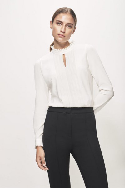 Silk blouse with mock-neck keyhole and black high-rise chinos