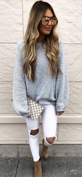 gray, chunky sweater with white, heavily torn skinny jeans
