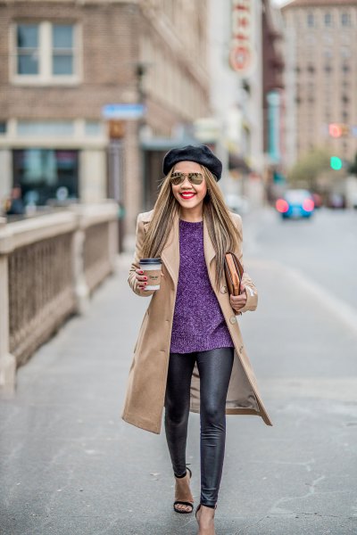 Blushing pink coat with dark blue sweater and black leather leggings