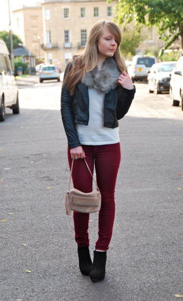 black, short-cut leather bomber jacket with maroon, slim-cut jeans