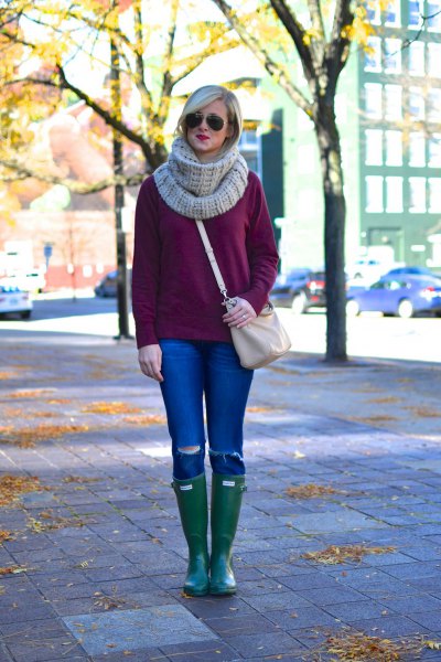 rough knitted sweater with gray scarf and knee-high leather boots