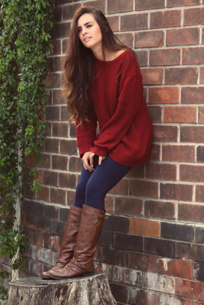 Dark red tunic sweater with a boat neckline, dark blue leggings and knee high boots