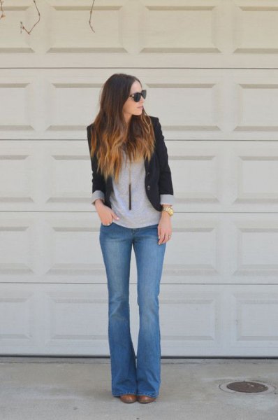 black blazer with gray tee and blue flare jeans