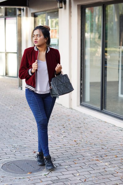 burgundy velvet blazer with gray tee with scoop neck and blue slim fit jeans