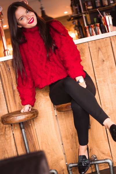 red knit sweater with suede with black slim fit jeans