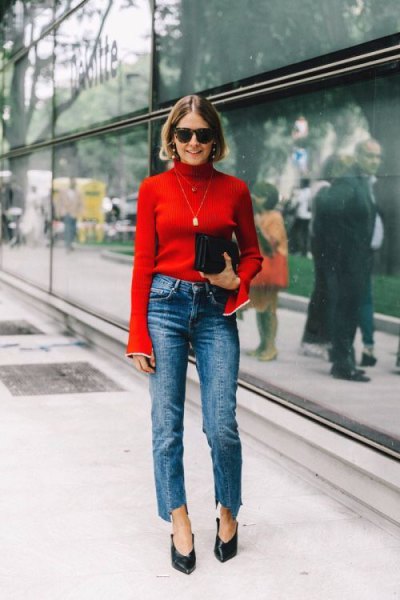 red sweater with back mock neck with blue cropped straight jeans