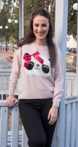 light gray panda printed graphic sweater with black slim fit jeans