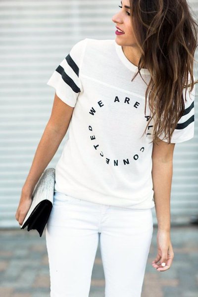 white cool tee with matching skinny jeans and sequin clutch bag