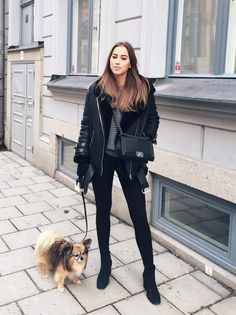 black flying jacket with gray chunky knit sweater and skinny jeans