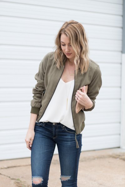 deep v-neck chiffon blouse with olive jacket and ripped jeans