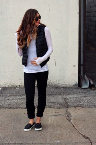 gray long sleeve t-shirt with black puffer vest and cuffed jeans