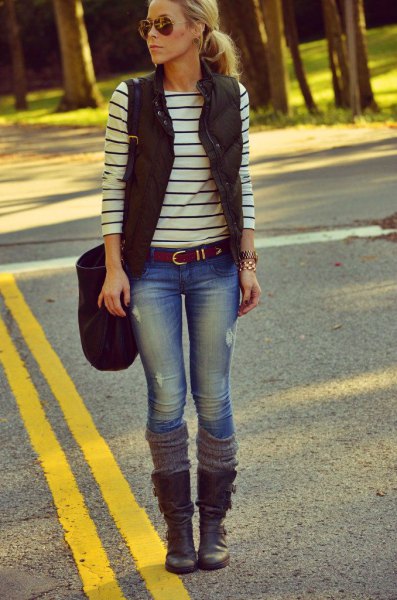 black puffer vest with striped long-sleeved tee and mid calf boots