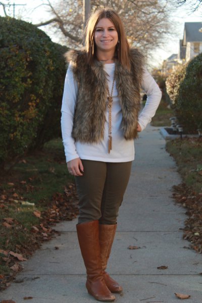 fur vest with white long-sleeved tee and brown shoes in knee-high shoes