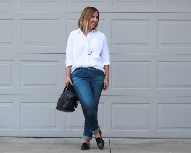 white button-up shirt with cuffed slim fit jeans and black loafers