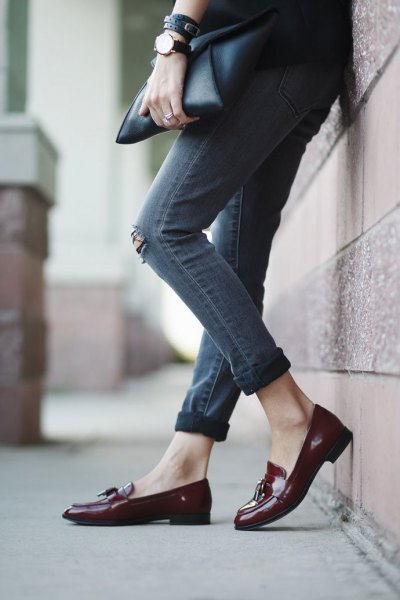 black blazer with gray cuffed skinny ripped jeans and burgundy loaf