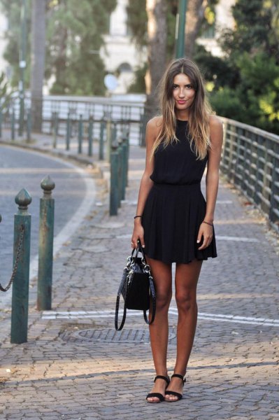 black fit and flare sleeveless mini dress with open toe heels and leather bag