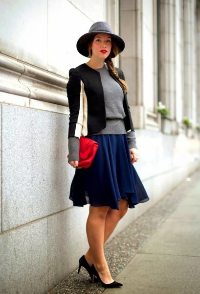 black and white fitted blazer with navy skater dress and felt hat