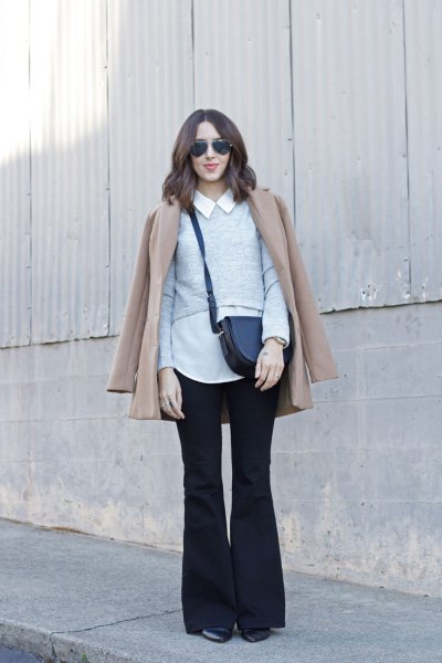 white collar shirt with a blushing pink coat and black flared jeans
