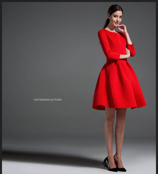 red long-sleeved mini-dress with black ballet heels