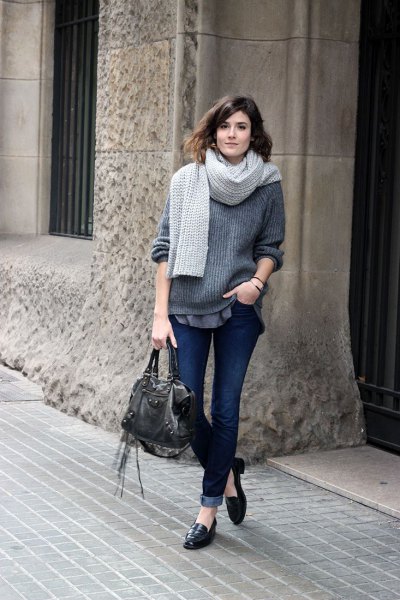 gray, ribbed chunky sweater with cuffed dark jeans and leather slip on loafers