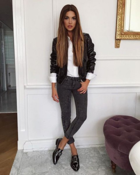 black leather jacket with white shirt and dark gray cuffed skinny jeans