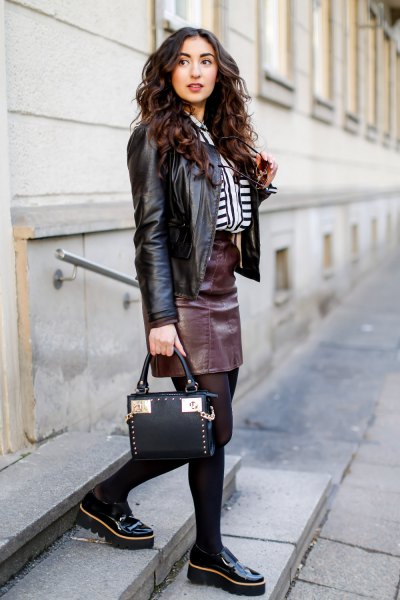black motorcycle jacket with leather skirt and platform links